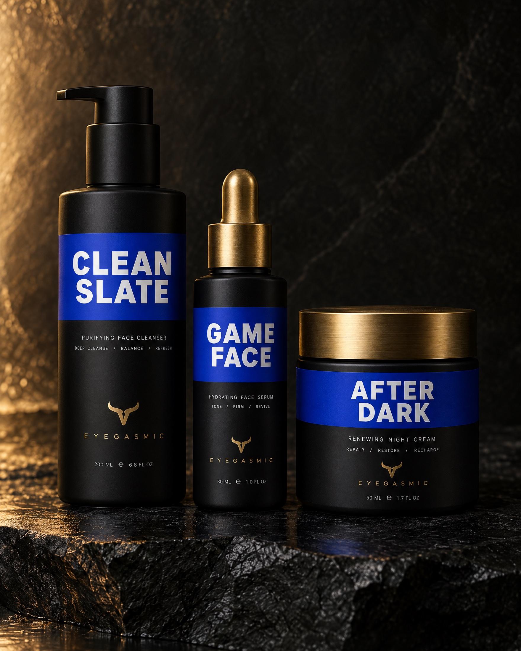 EYEGASMIC skincare in cobalt: Clean Slate cleanser, Game Face serum and After Dark night cream, matte black with bold cobalt bands and brass horn marks.